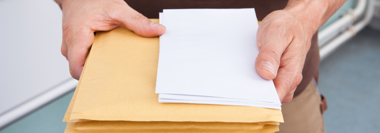 Postman Holding Letters
